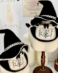 Two Halloween mage costume sets with witch hats and embroidered bibs