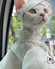 Side view of white lace cat princess hat with ear opening and chin tie