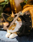 Cat wearing steampunk witch hat with pentagram charm