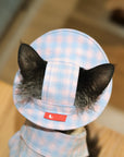 Back view of pink plaid bucket hat showing ear-cutout construction and adjustable strap